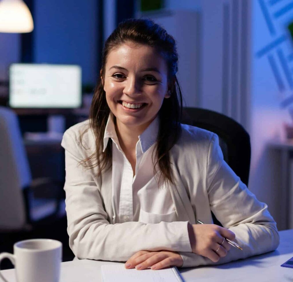 close up portrait of business woman smiling at camera e1715795709821.jpg